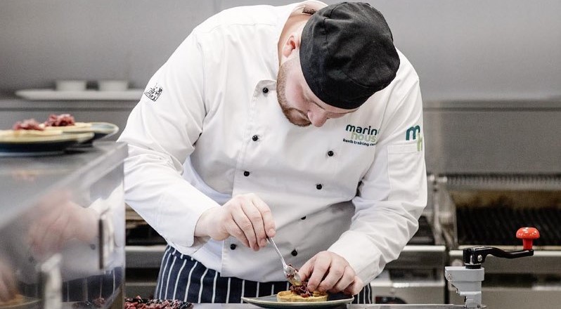 Commis Chef plating food